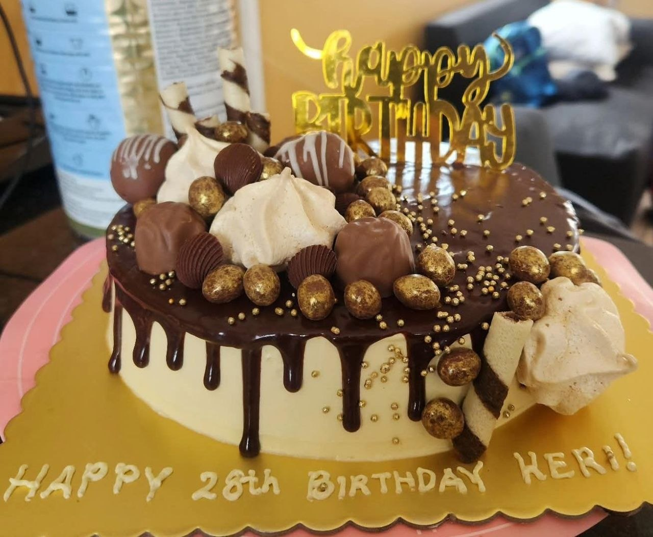 Chocolate drip celebration cake with gold topper